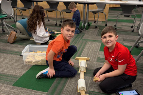 Students working on project on floor