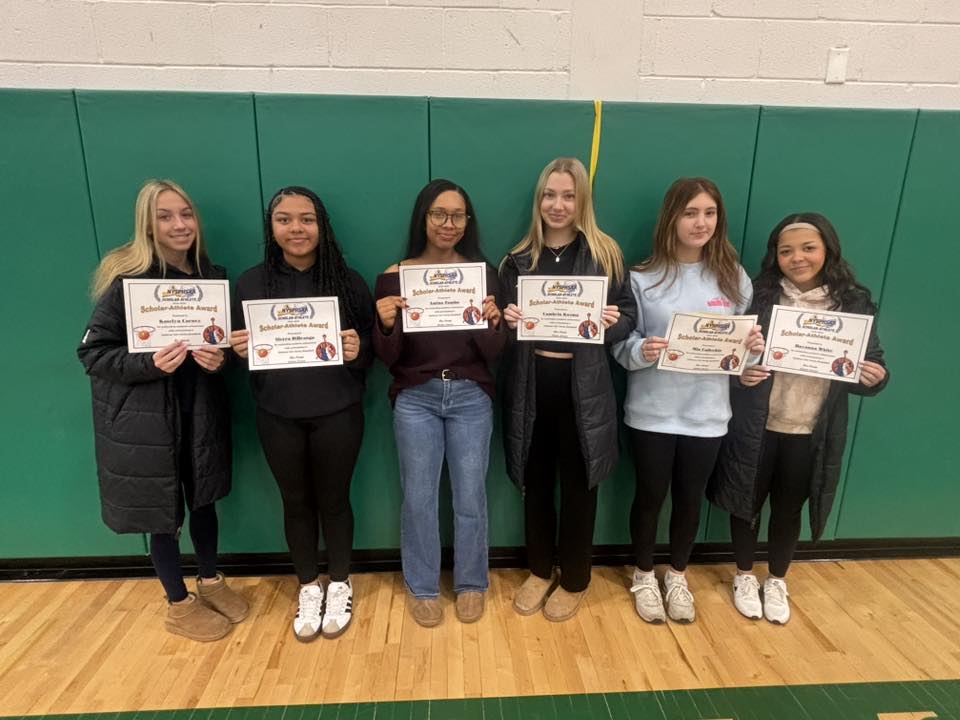 Students posing with scholar athlete certificates