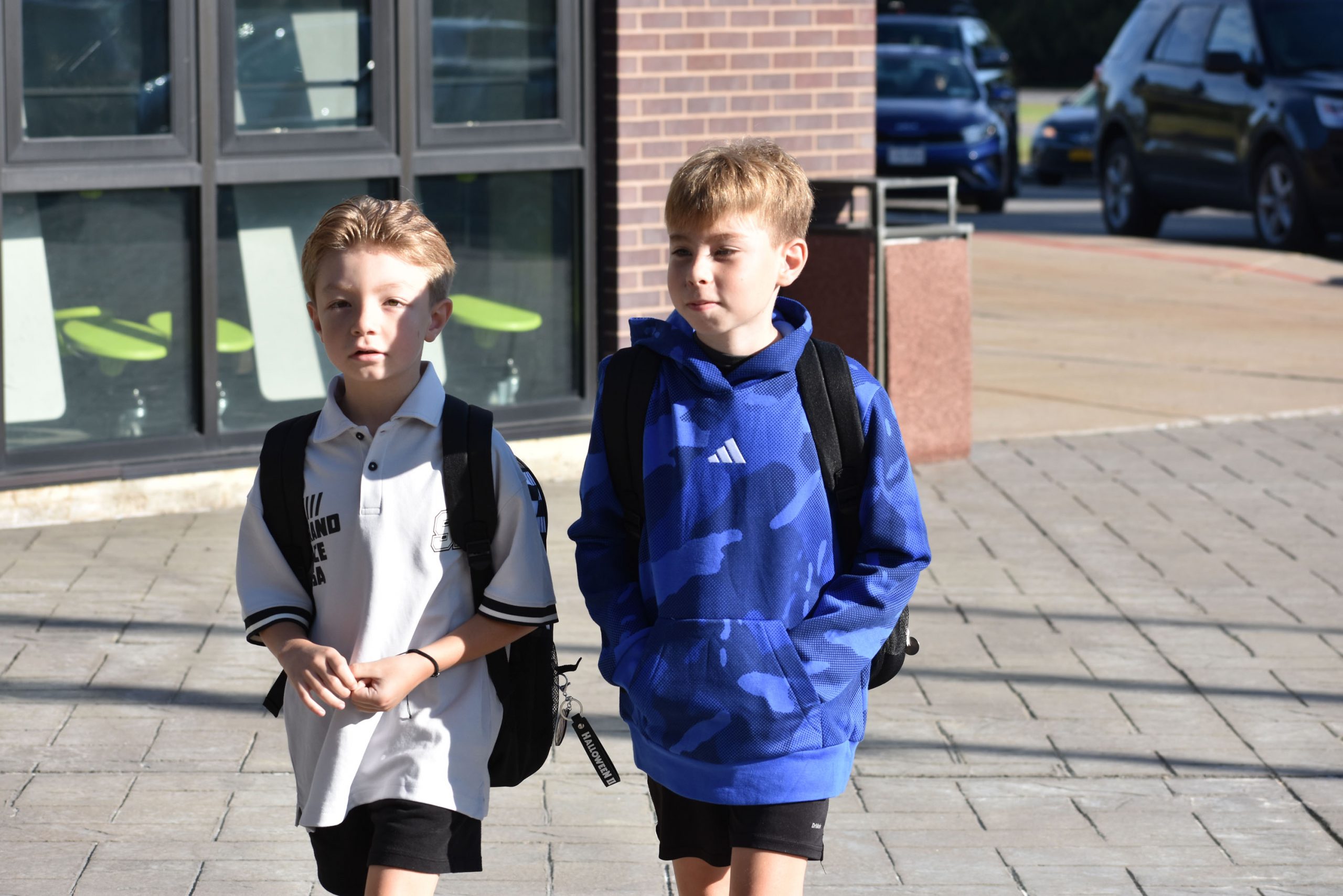 Students walking outside toward the school on the fist day of school