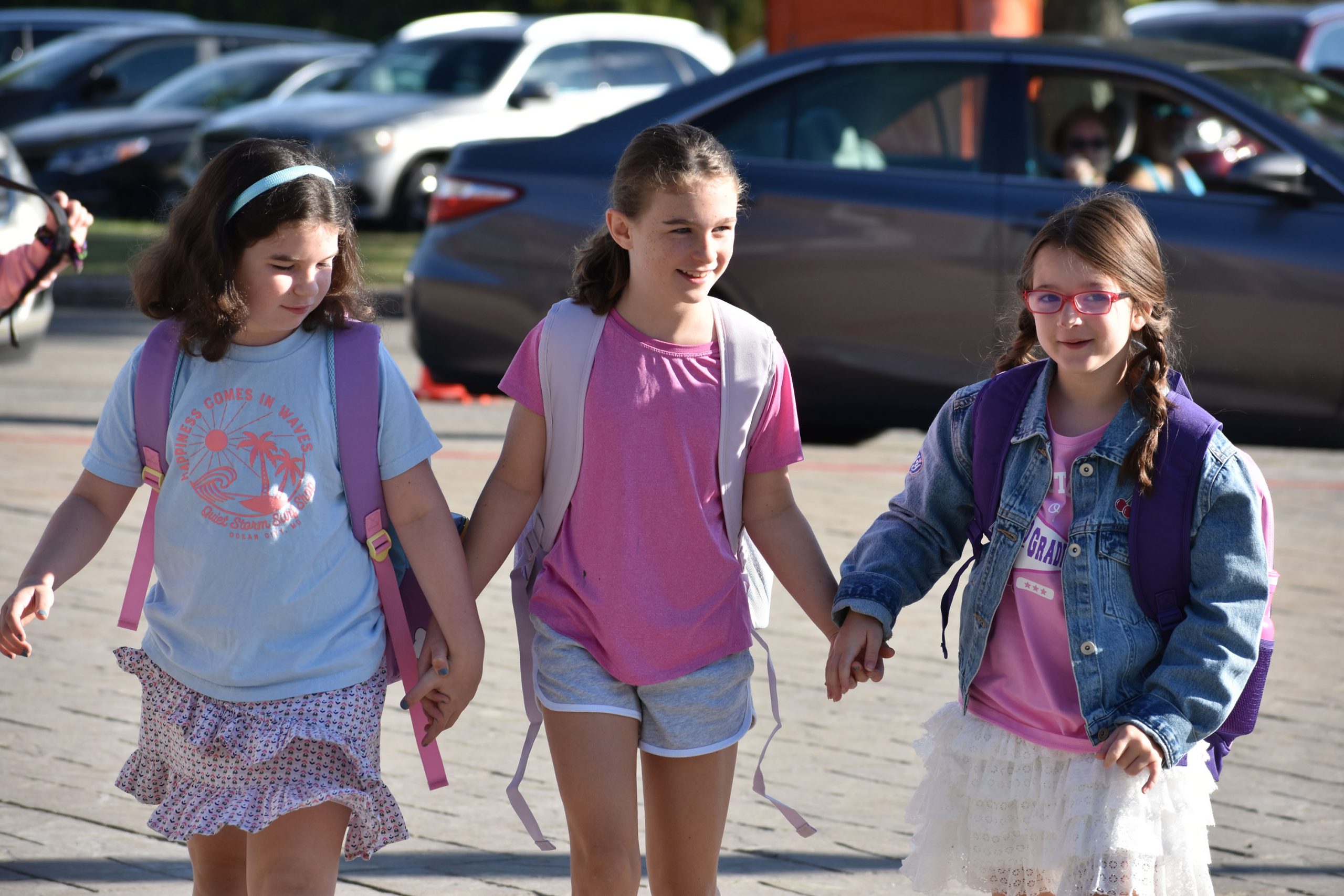 Students walking outside toward the school on the fist day of school