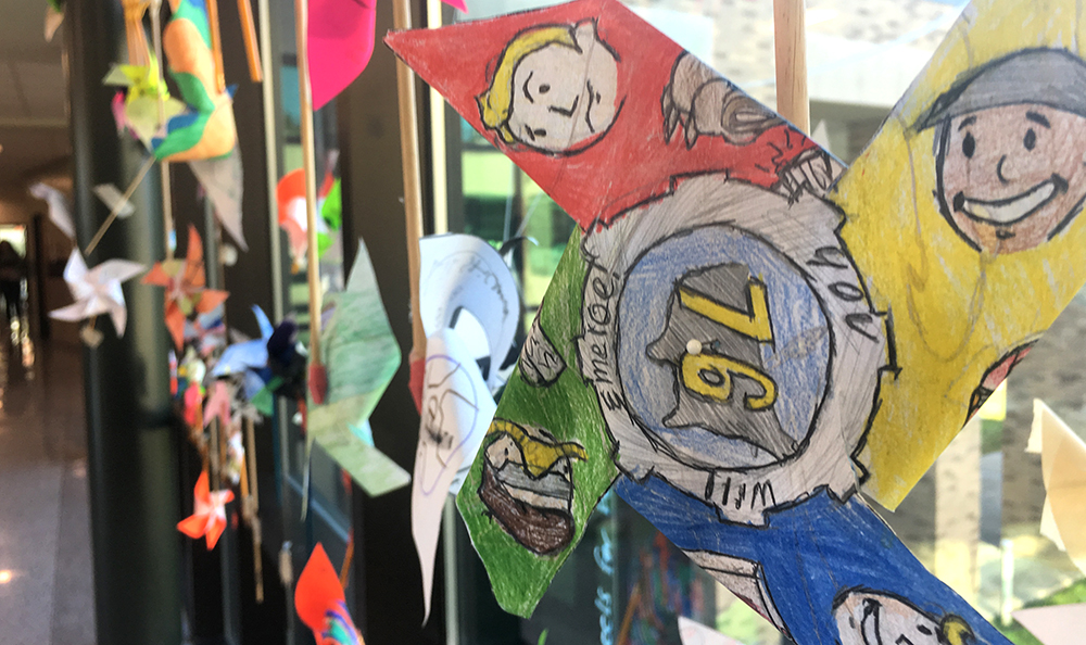 Close-up of pinwheels with students' drawings