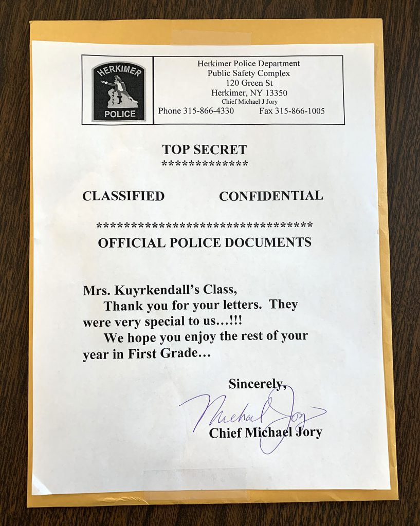 Envelope with label that reads, "Top Secret, Classified, Confidential, Official Police Documents, Mrs. Kuyrkendall's Class, Thank you for your letters. They were very special to us!!! We hope you enjoy the rest of your year in First Grade. Sincerely, Chief Jory"