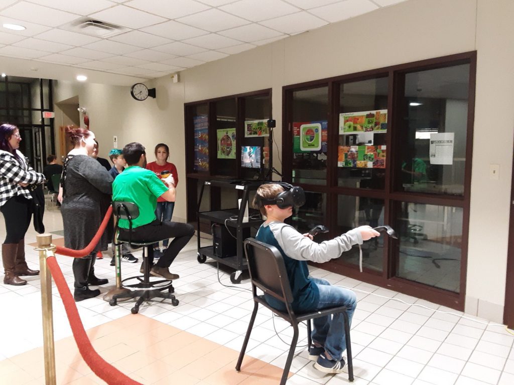 Students play a virtual reality simulation
