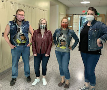 Four teachers dressed up as characters from the book The Outsiders