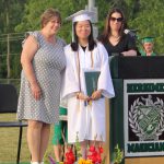 A student receives her diploma