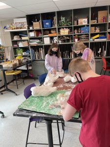 Students work on costumes for the Lion King Jr. 