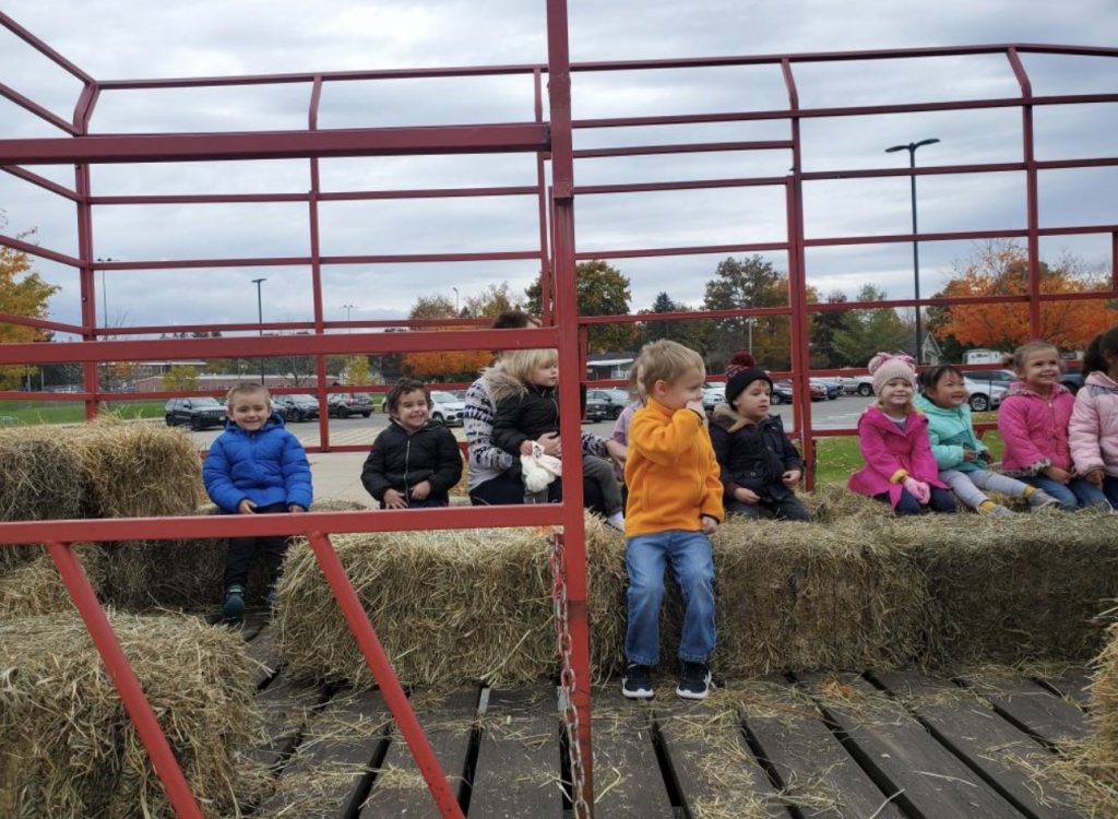 Students on a wagon ride at Annutto's