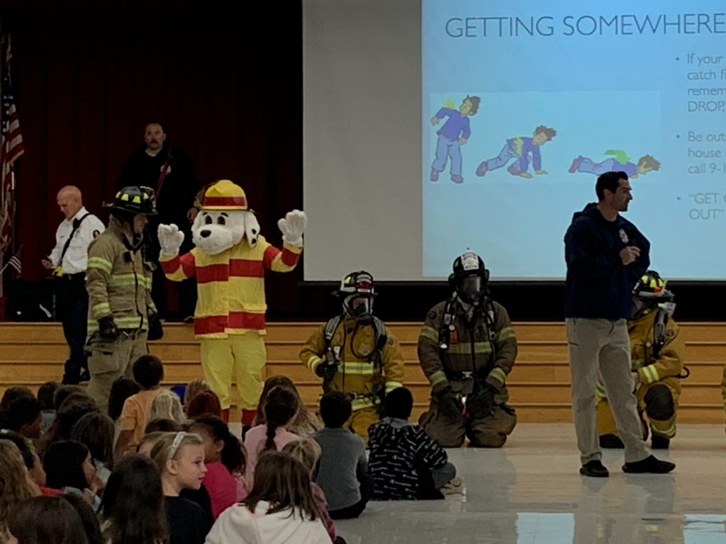 Firefighters presenting at elementary assembly