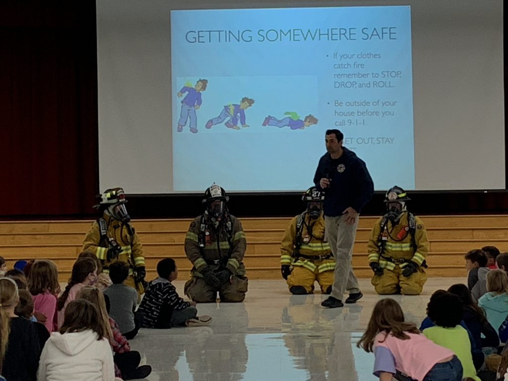 Firefighters presenting at elementary assembly