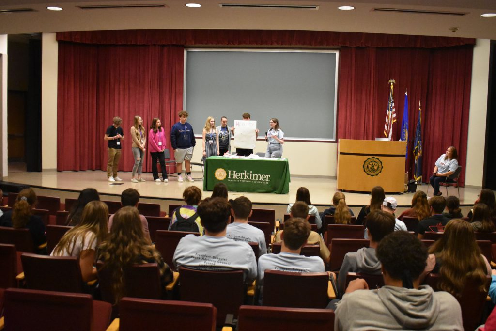 Herkimer students presenting on stage at the Youth Summit at Herkimer College