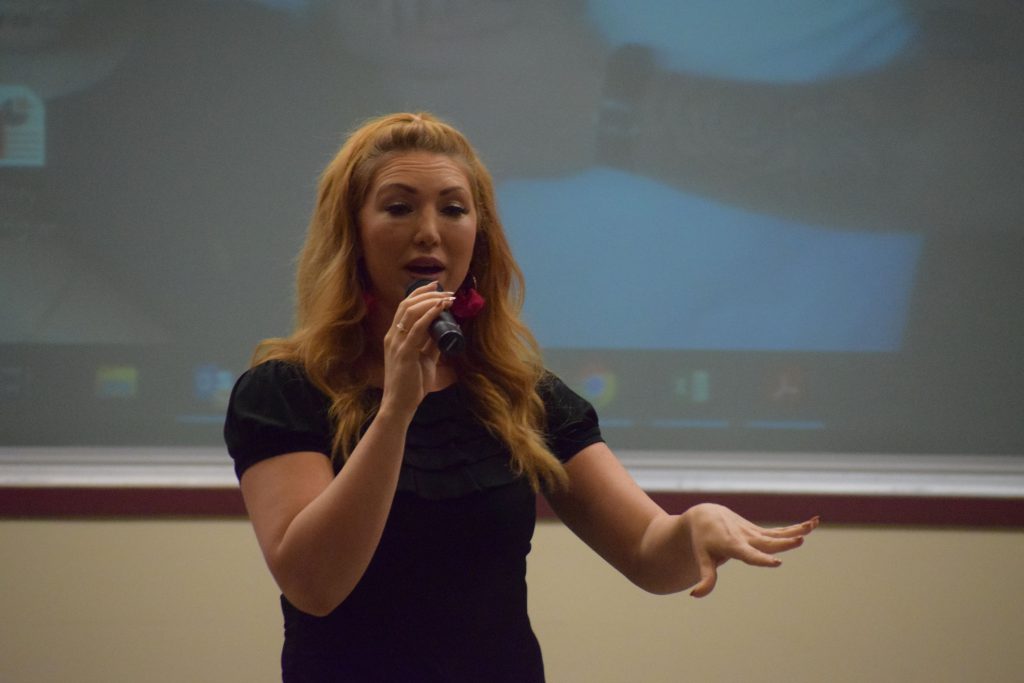 Singer and motivational speaker Jessie Funk performing on stage at the Youth Summit at Herkimer College