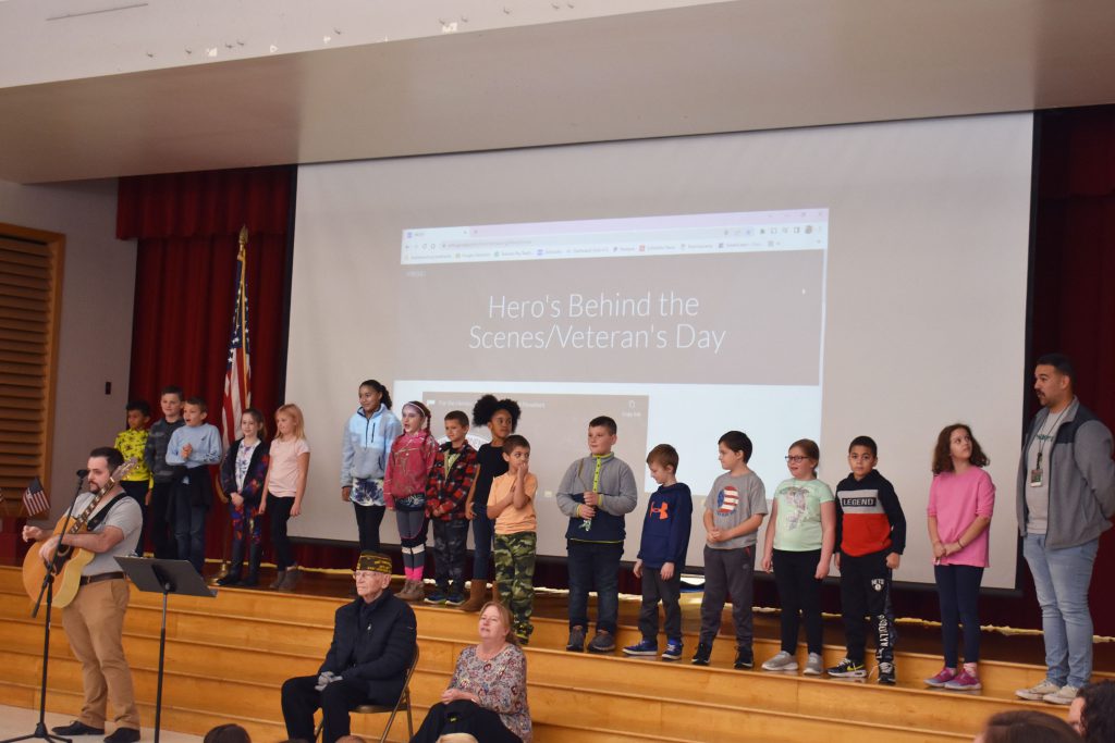 Students on stage at a respect assembly