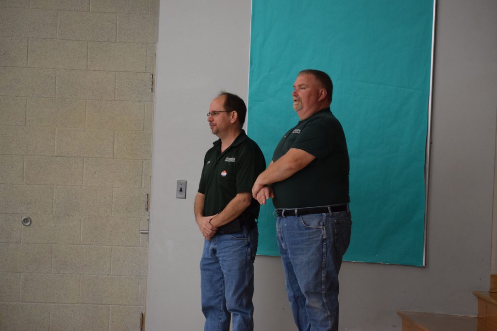 Herkimer elementary maintenance workers on stage at a respect assembly
