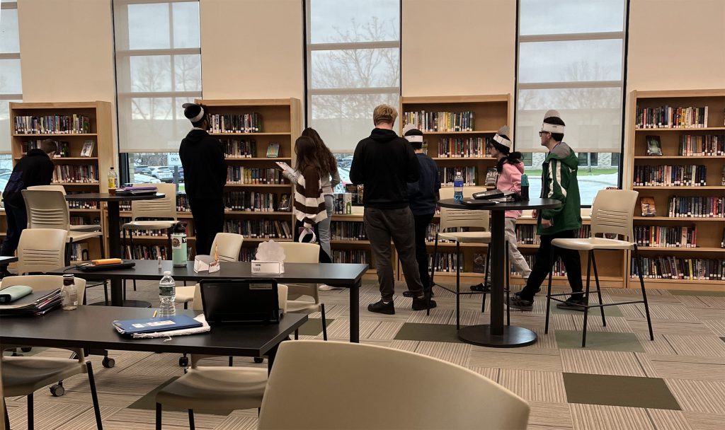 Herkimer seniors participating in a turkey scavenger hunt in the Library Media Center