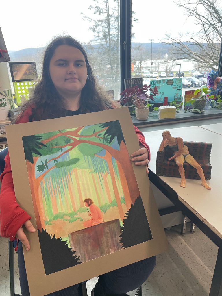 Art student Lyla Williams with her award-winning acrylic painting and sculpture