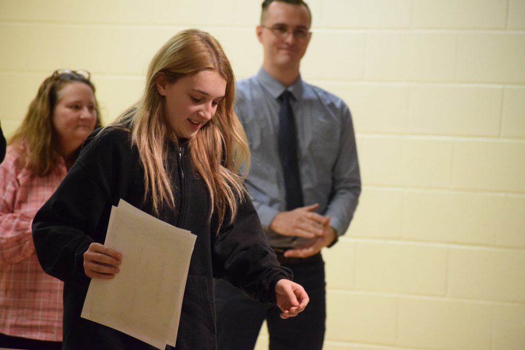 Herkimer student walking off stage after receiving Pathways Academy awards