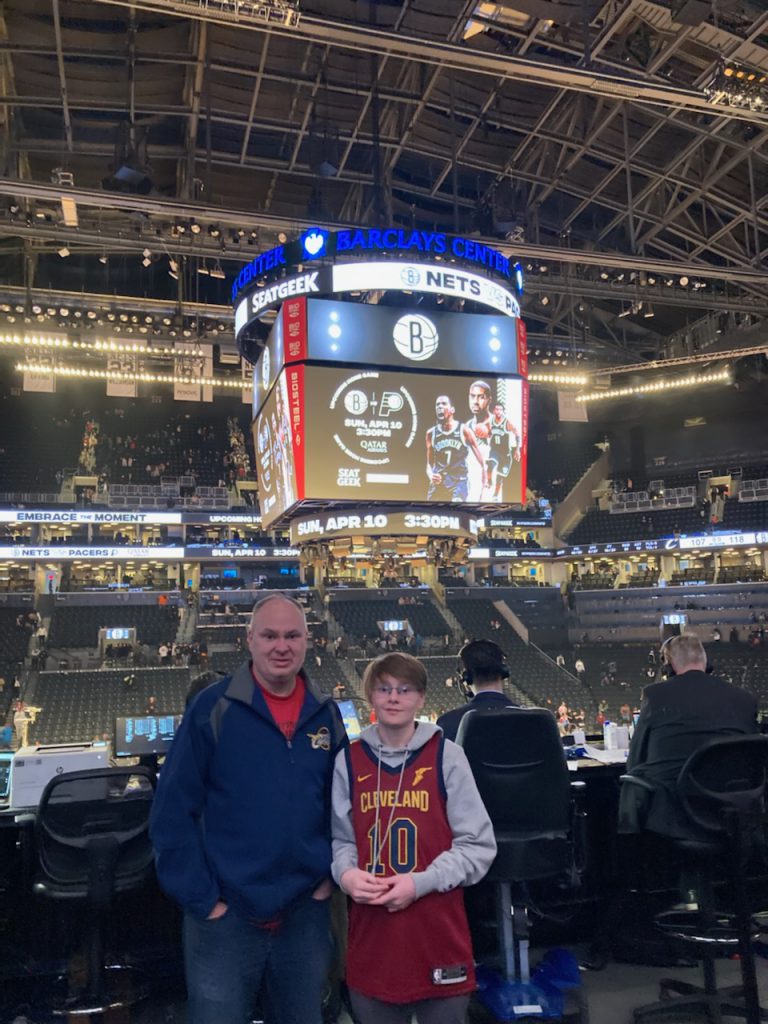 Paul Valasek and his son at an NBA game.