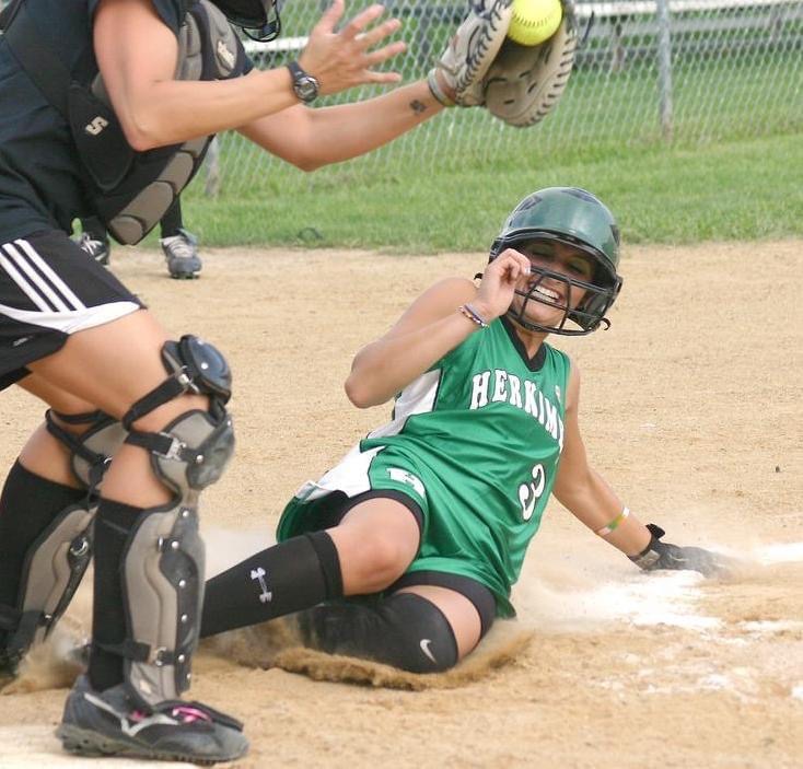 Brianne Bello sliding into home playing softball