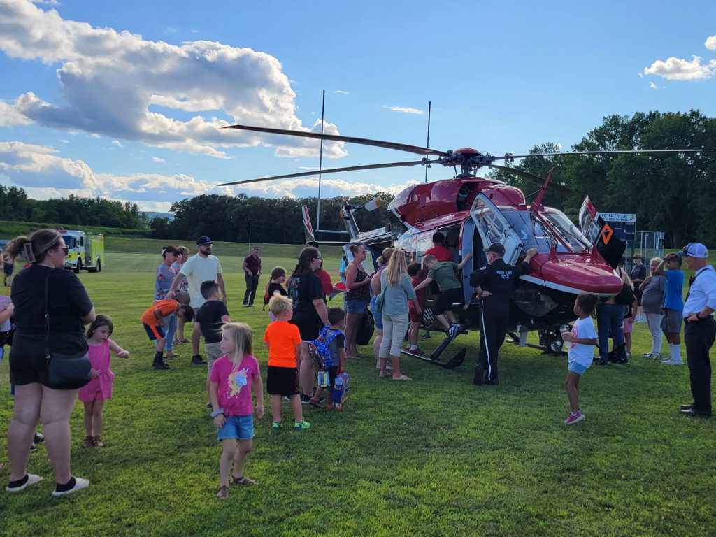 Community members looking at helicopter