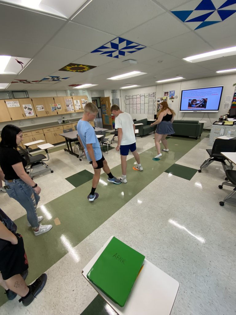 Students doing physical activities in classroom