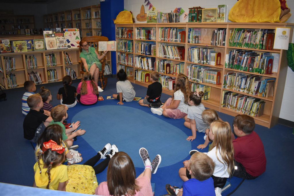 Elementary library students and teacher