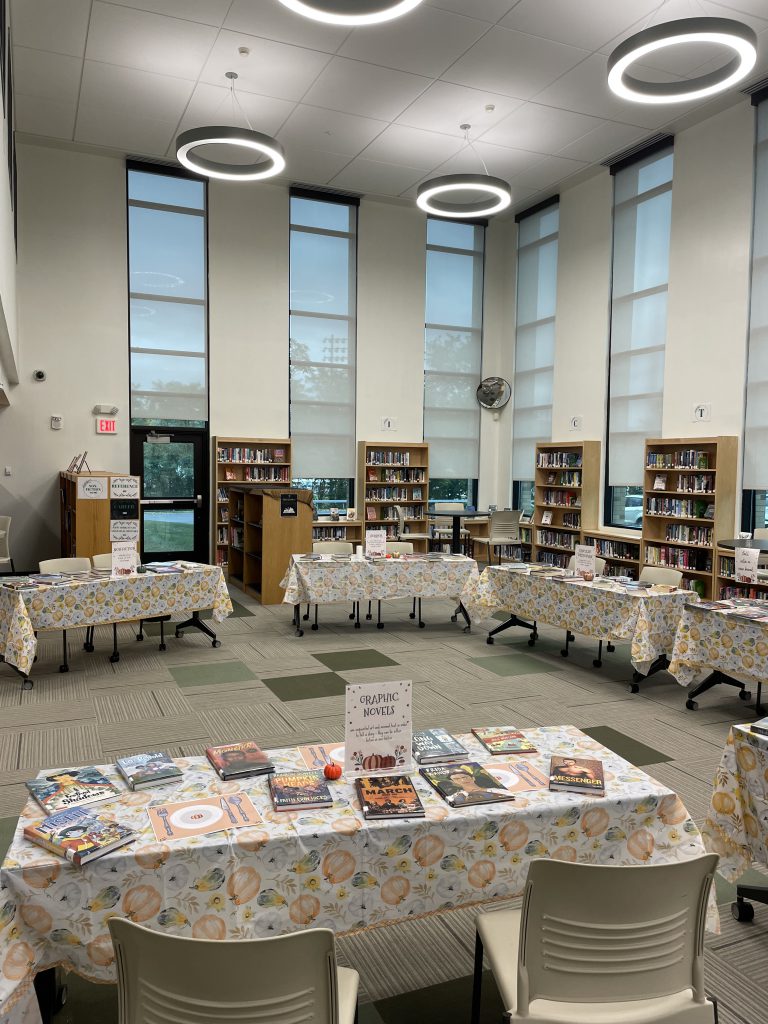 Library Media Center with stations set up for book-tasting event