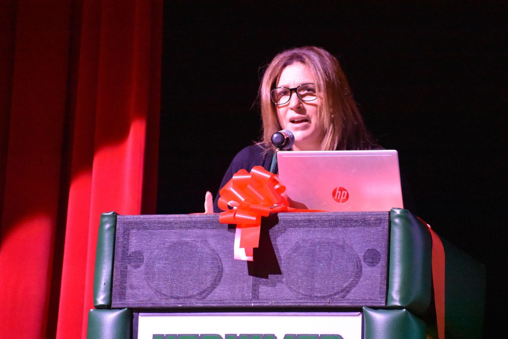 Herkimer Superintendent Kathy Carney speaks on stage at Connected Community Schools ribbon-cutting ceremony for Herkimer