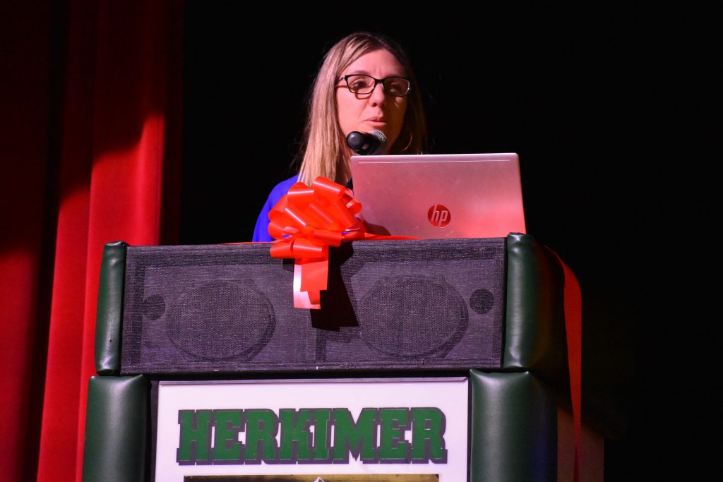 Herkimer Elementary Principal Renee Vog speaks on stage at Connected Community Schools ribbon-cutting ceremony for Herkimer