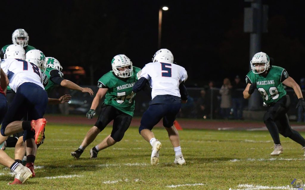 Herkimer senior Michael Goodson making a tackle on the football field