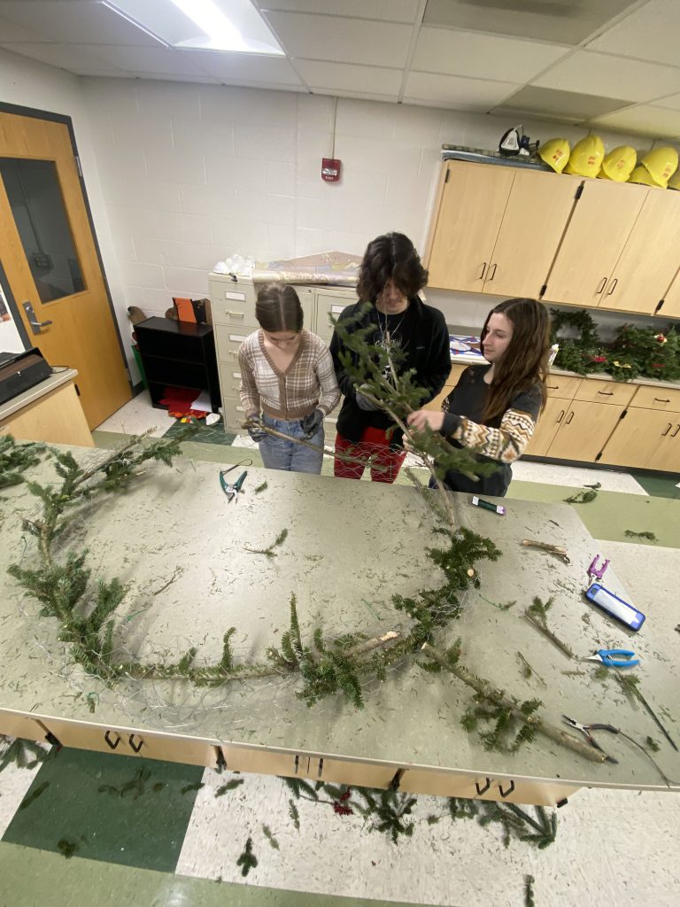 Landscape design students making a wreath