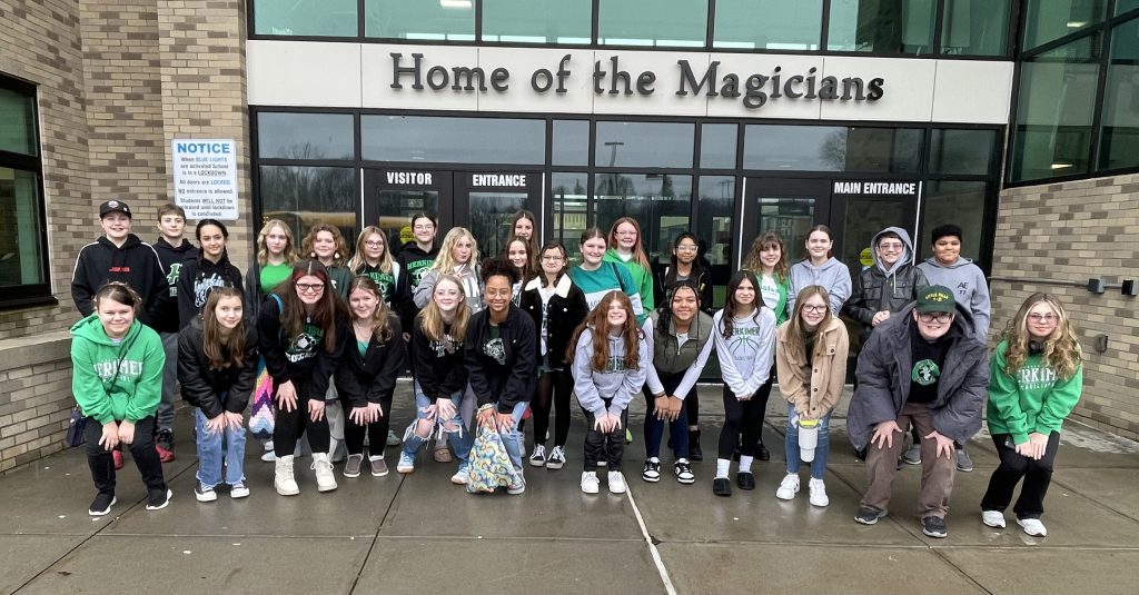 Herkimer Middle School chorus students pose in front of the Jr./Sr. High School