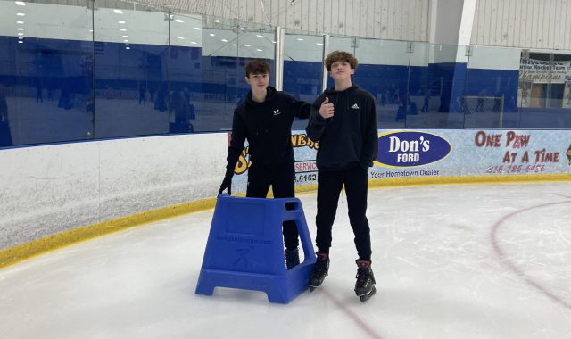 Two students on ice rink