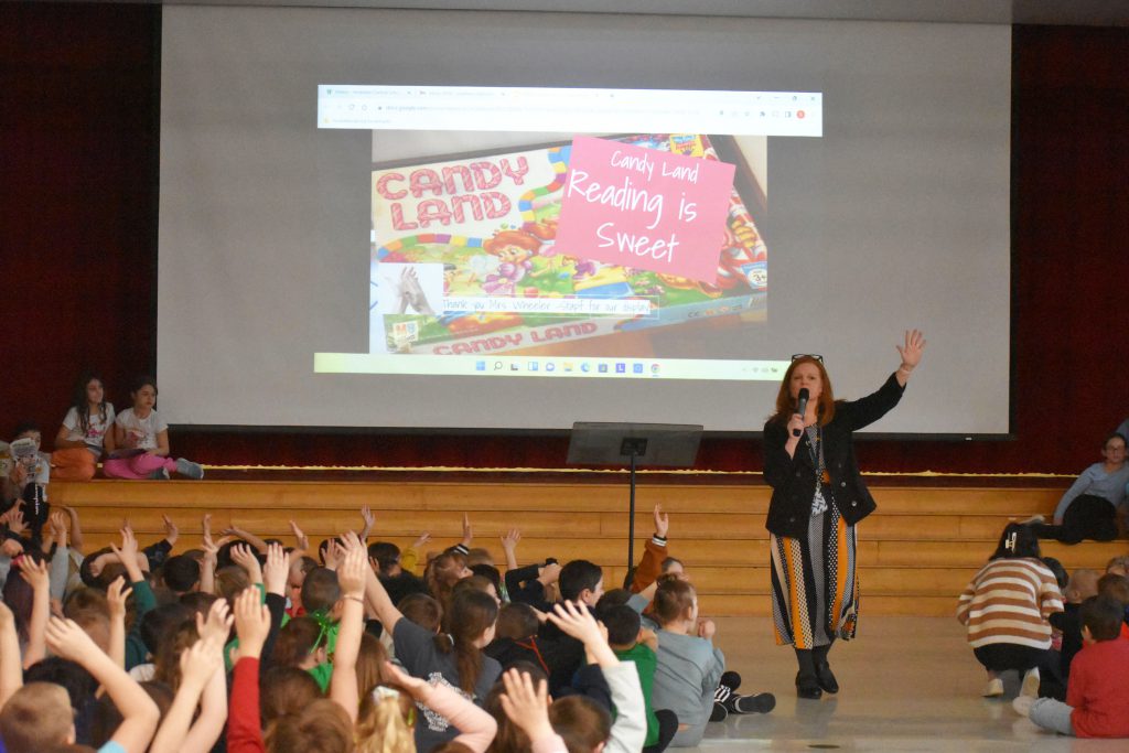 Jennifer Olds speaking at school assembly