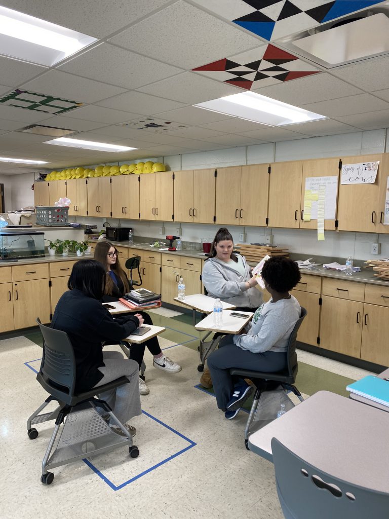 High school agriculture students practicing reading