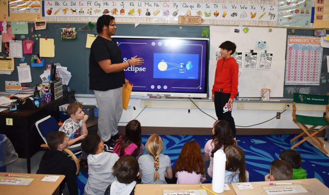 Jr./Sr. High School students present about the eclipse to elementary students
