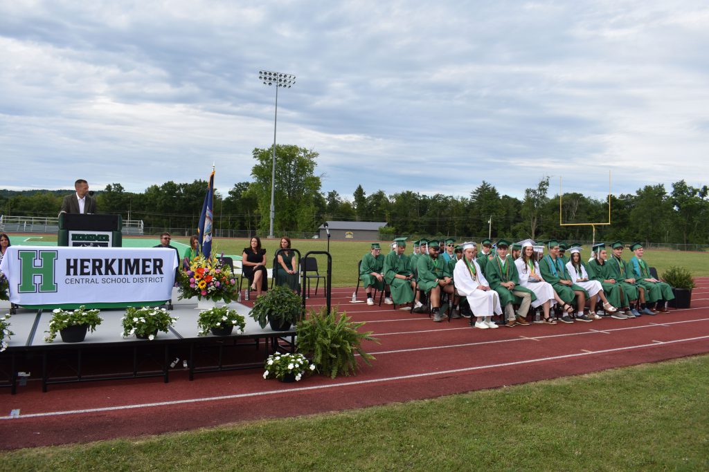 High School Principal Zach Abbe speaking to graduates at graduation