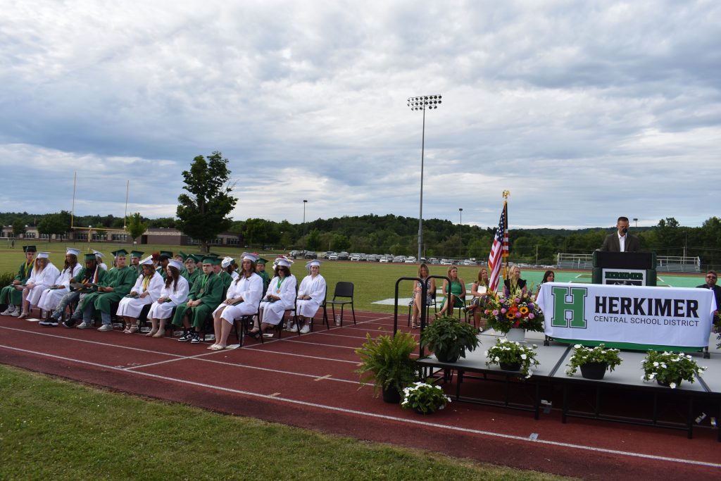 High School Principal Zach Abbe speaking to graduates at graduation