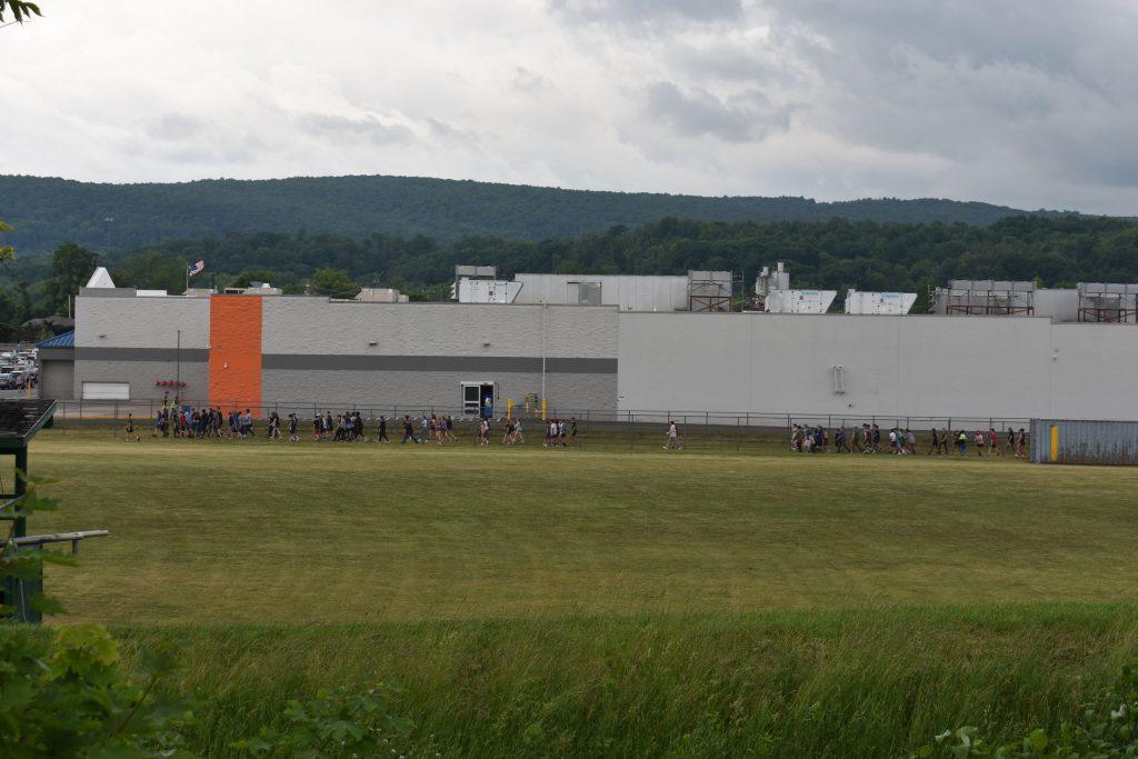 Far view of middle school students on a school walk