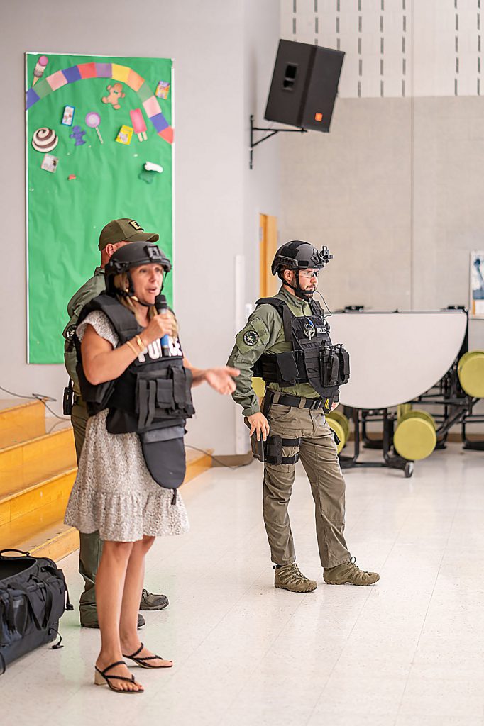 Principal Renee Vogt and two police members at assembly
