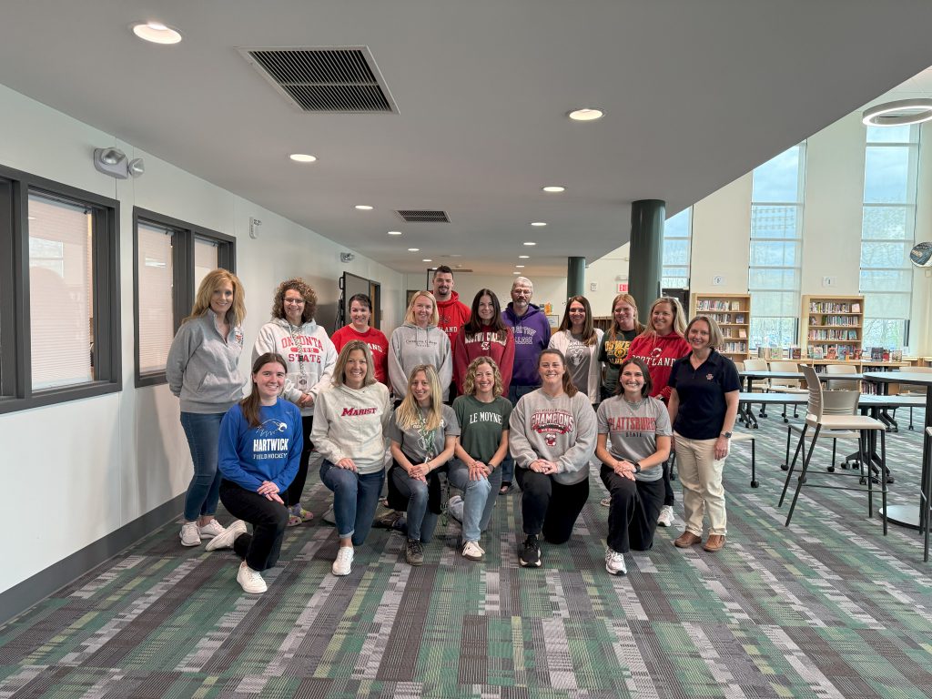Herkimer Middle-High School staff wearing clothing representing their alma maters.
