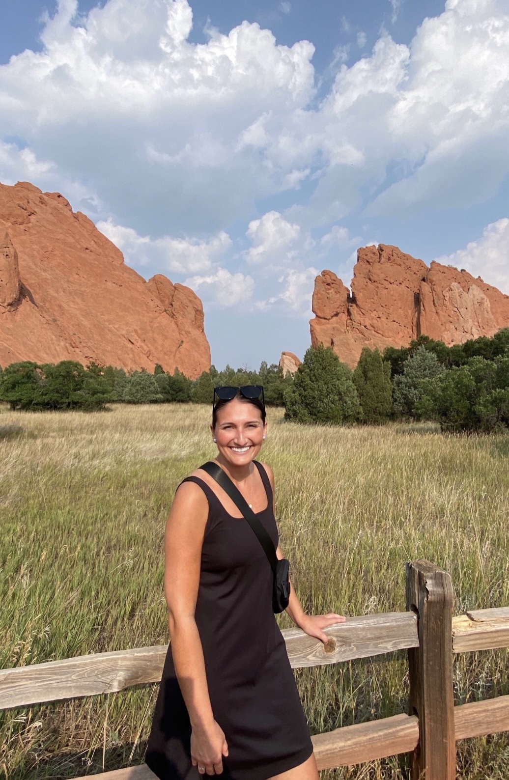 Library media specialist Brianne Bello in front of mountains