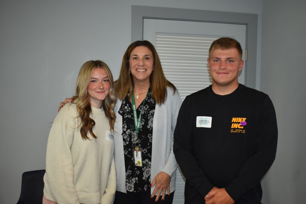 Kathleen Carney and students Sarah Huyck and Landon Ploss