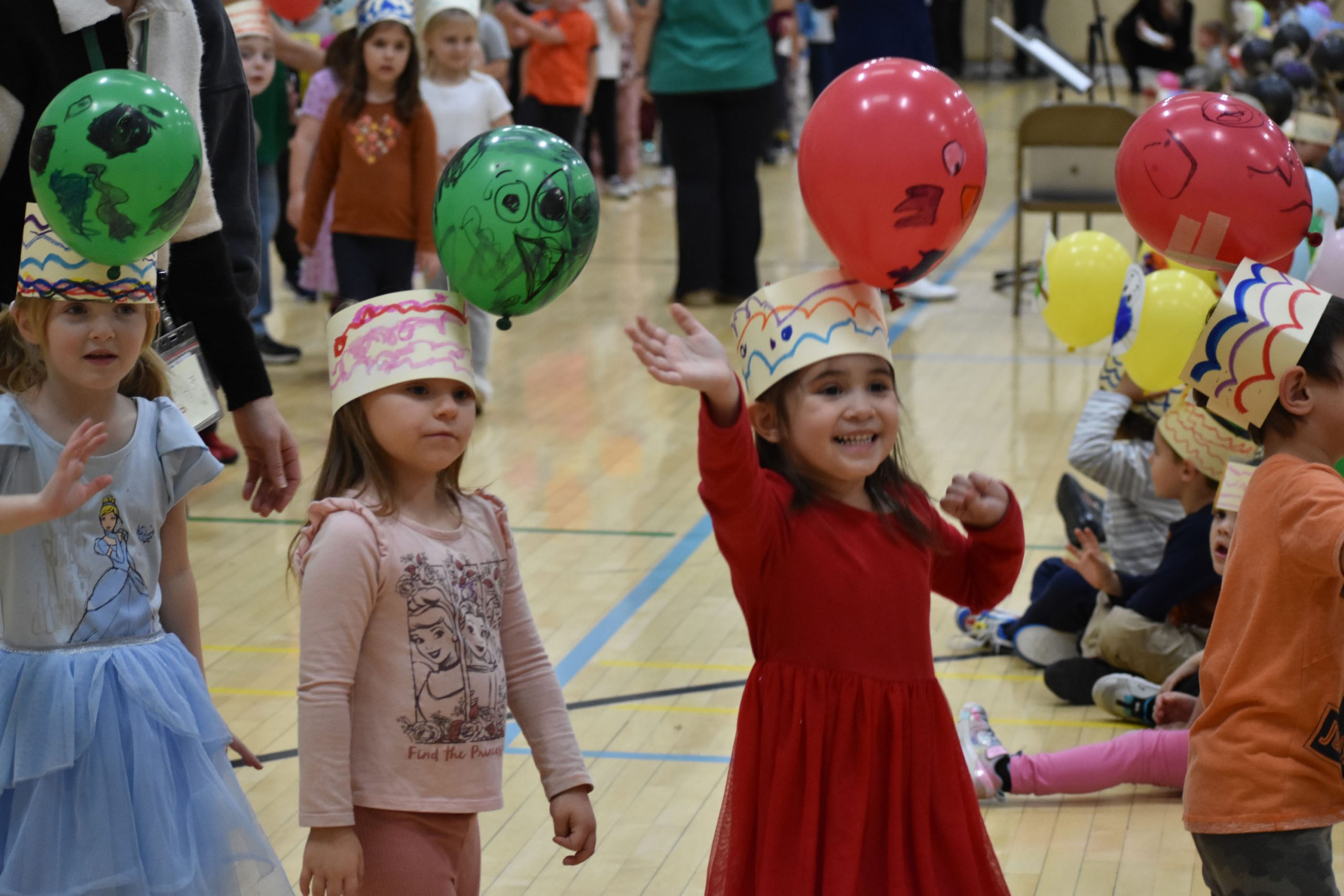 Students in Thanksgiving parade in school gym