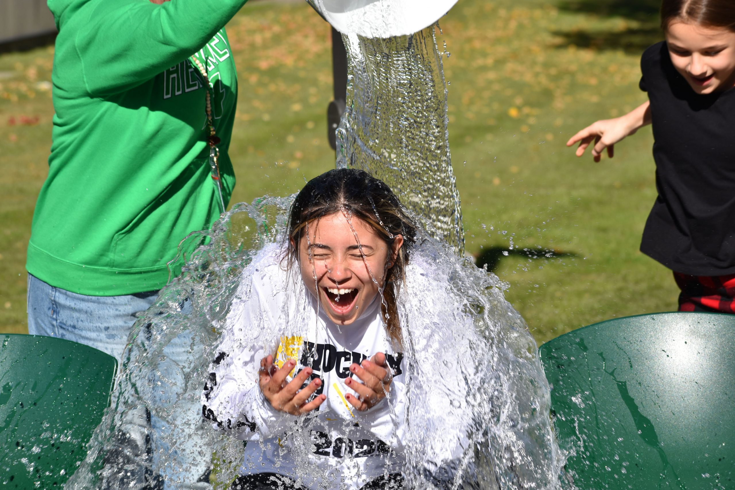 Student getting water dumped on her to raise money