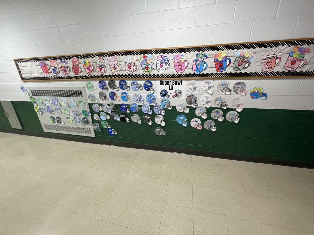 Paper helmets decorated as Seattle Seahawks or New Englands Patriots