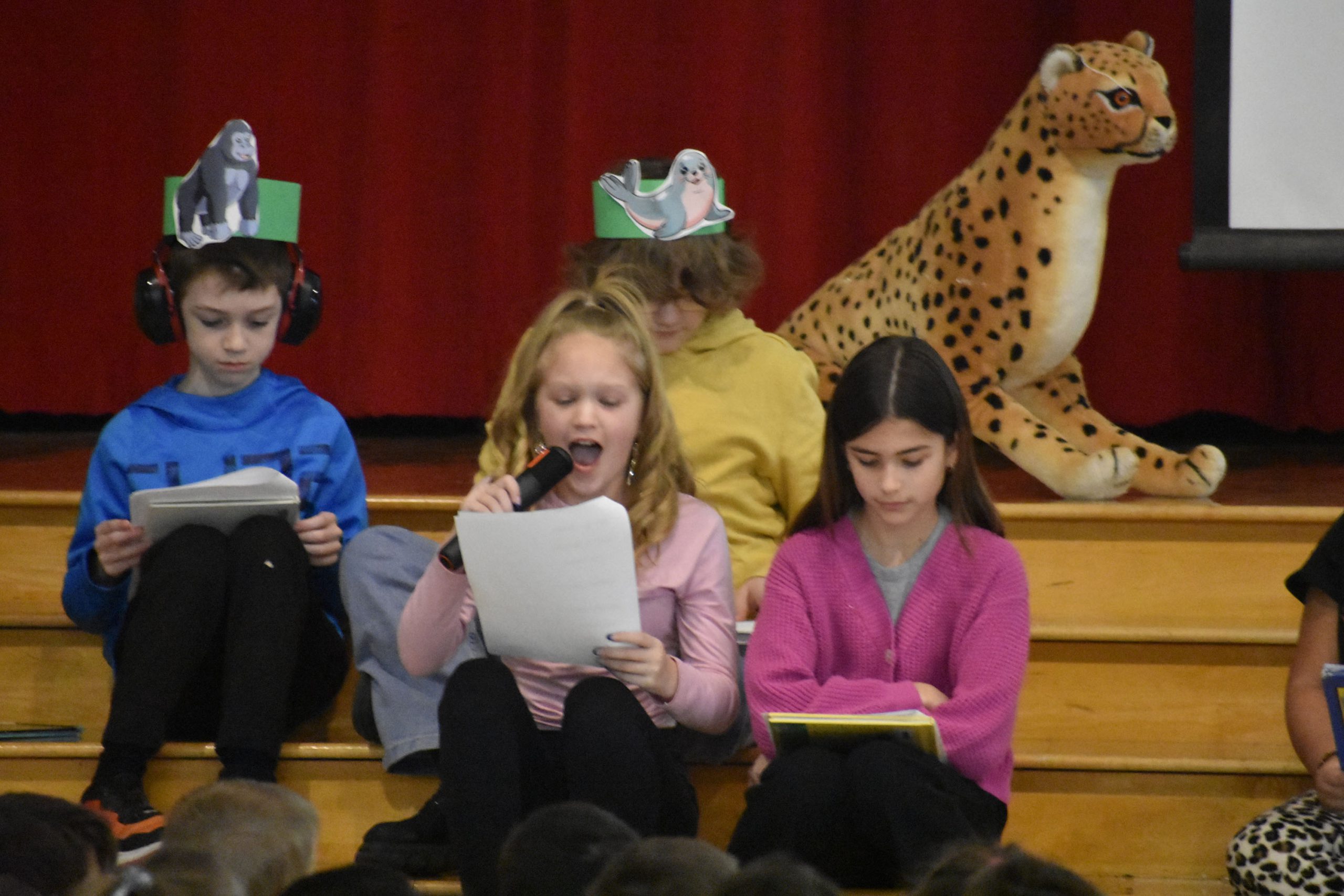 Students presenting on stage during PARP kickoff assembly