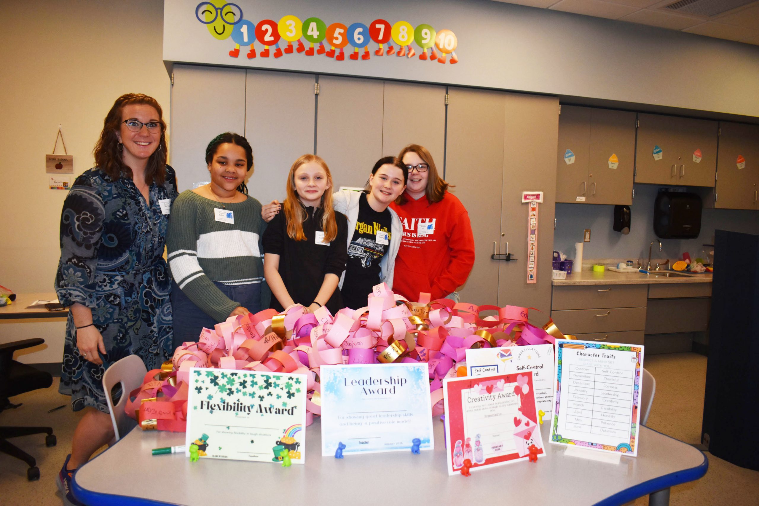 Respect Club members and advisor posing for photo at SBI Showcase event