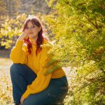 Rylee Hisert outside by trees