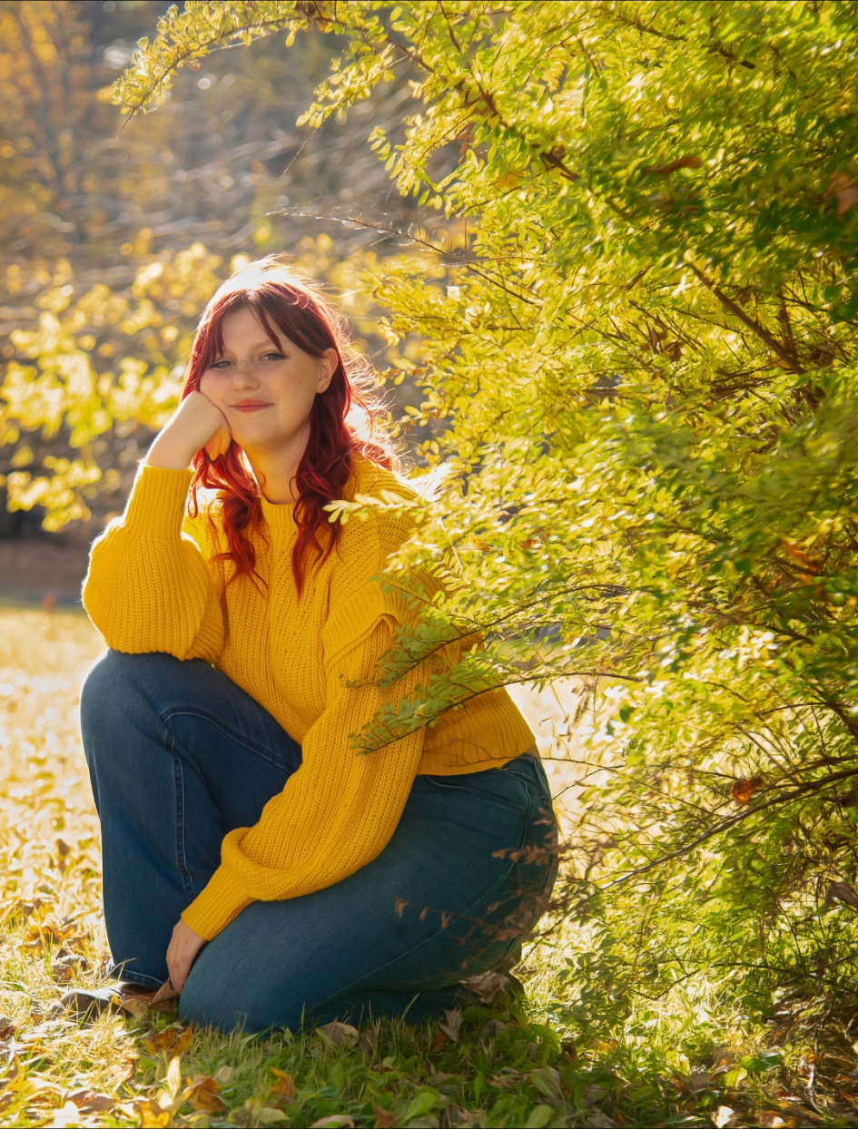 Rylee Hisert outside by trees