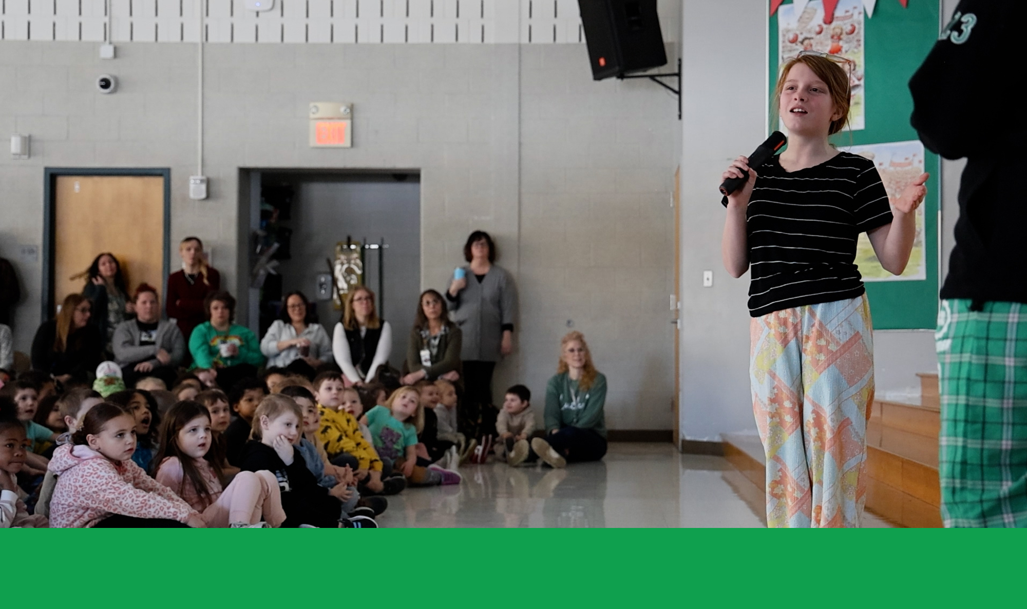 Student speaking as other students look on at Respect Assembly